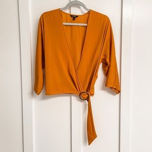 Express satin blouse. Tie bottom, flowy sleeves. Burnt orange